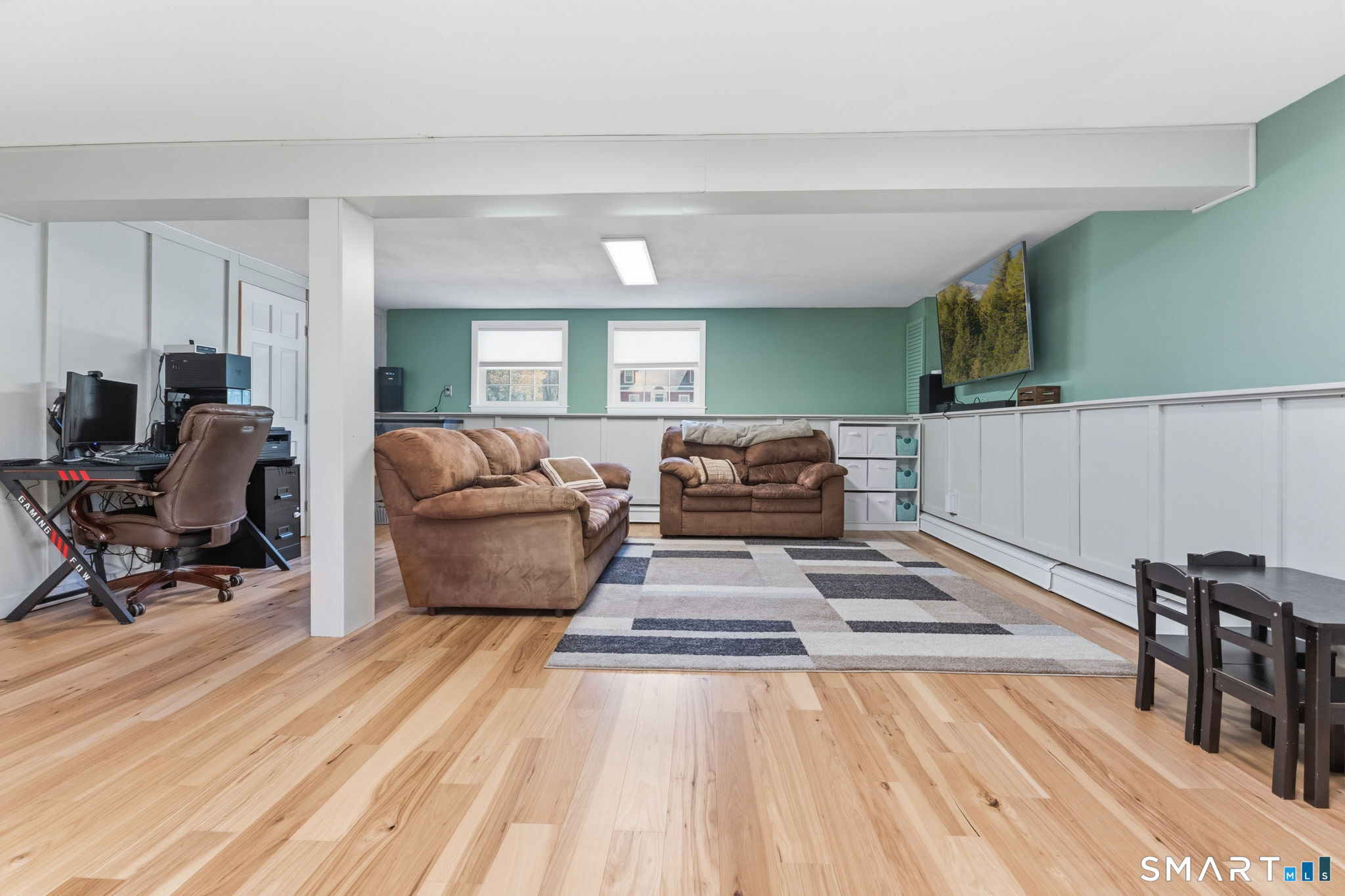 523 Essex Road Westbrook, CT 06498 - Photo 24 of 37 a living room with furniture and a wooden floor
