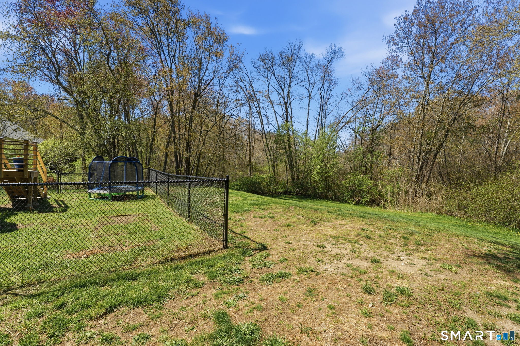 523 Essex Road Westbrook, CT 06498 - Photo 30 of 37 a backyard of a house with lots of green space