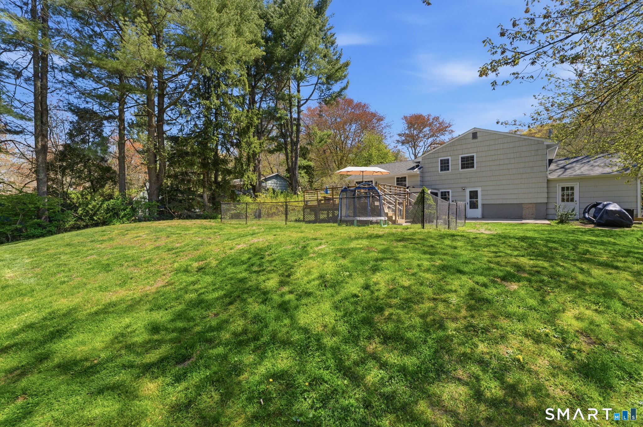 523 Essex Road Westbrook, CT 06498 - Photo 32 of 37 a view of a house with a yard porch and sitting area