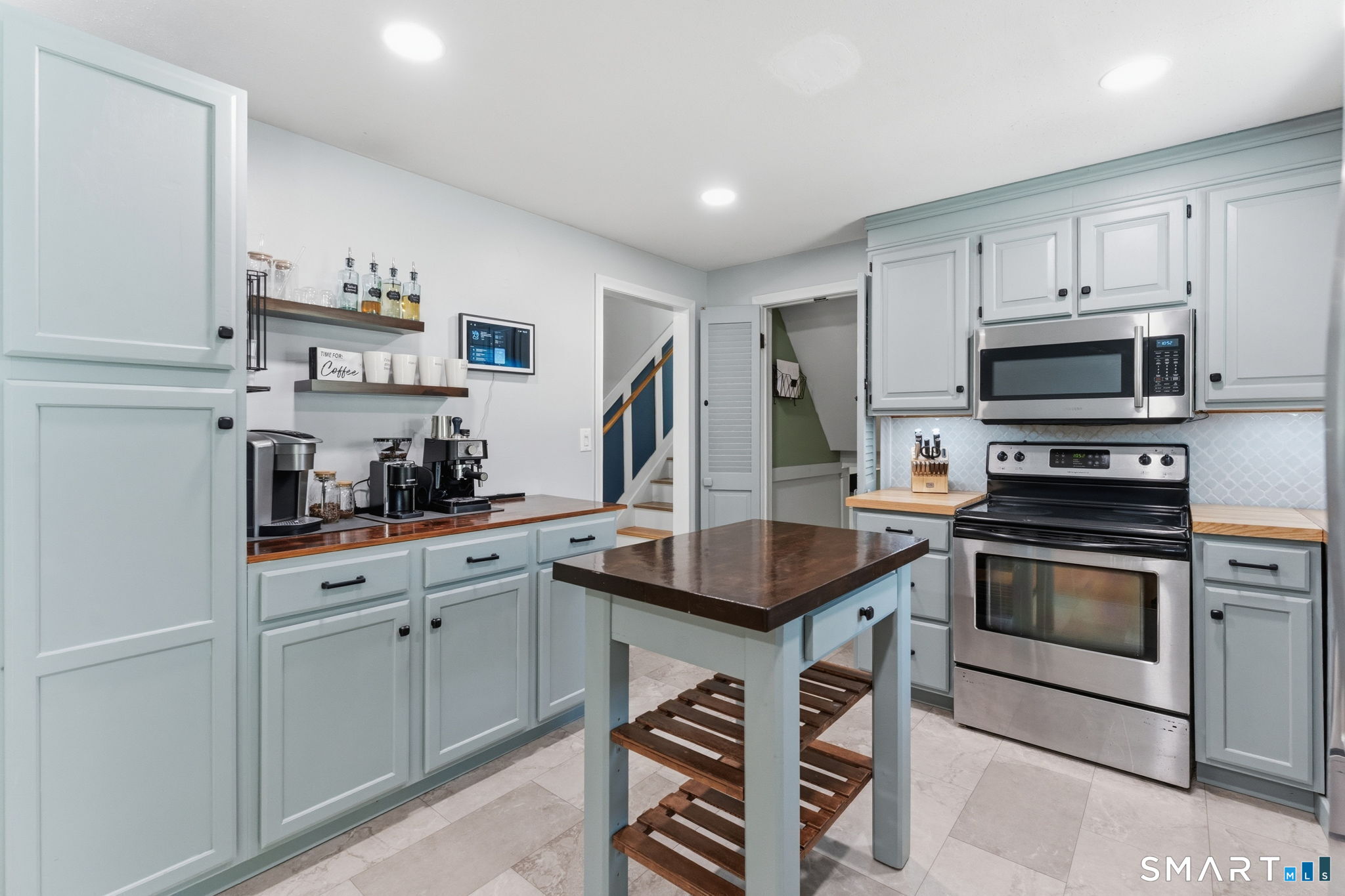 523 Essex Road Westbrook, CT 06498 - Photo 9 of 37 a kitchen with stainless steel appliances granite countertop a sink and cabinets