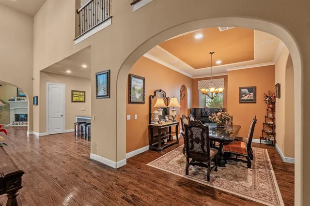 a view of a dining room with furniture and wooden floor