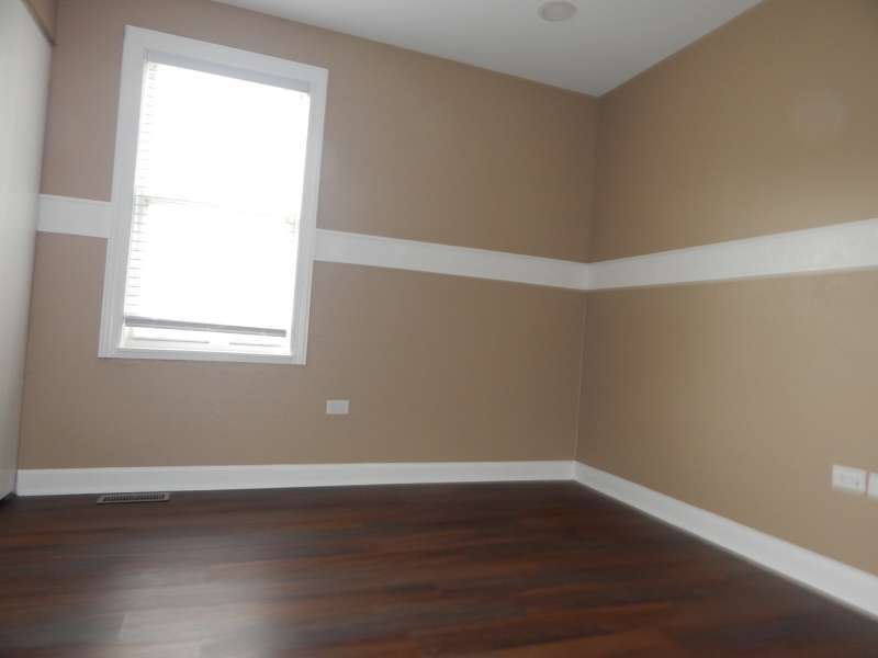 1216 Calico Avenue Naperville, IL 60564 - Photo 12 of 16 a room with wooden floor and windows