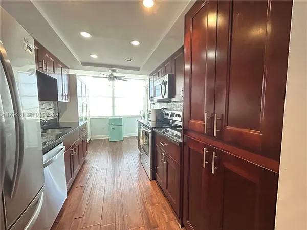 a bedroom with a bed and dresser