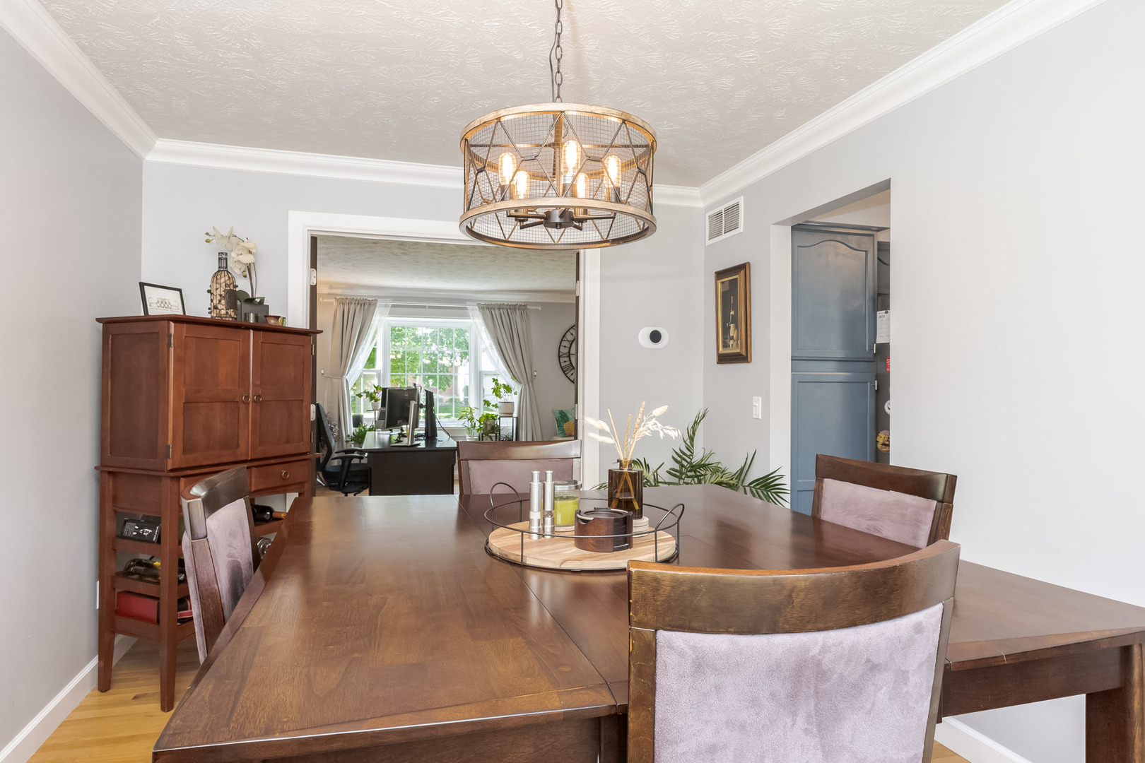 3308 Cumbria Drive Bloomington, IL 61704 - Photo 11 of 48 a dining room with furniture a chandelier and wooden floor