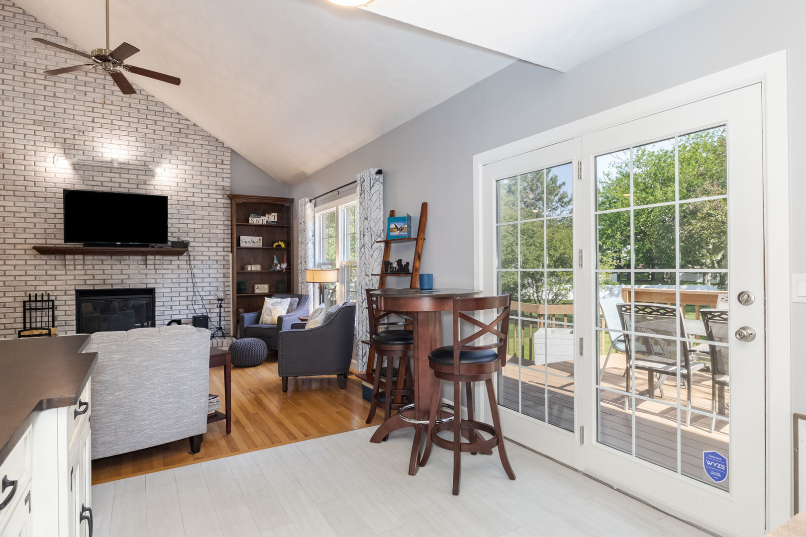 3308 Cumbria Drive Bloomington, IL 61704 - Photo 17 of 48 a living room with furniture a flat screen tv and a fireplace
