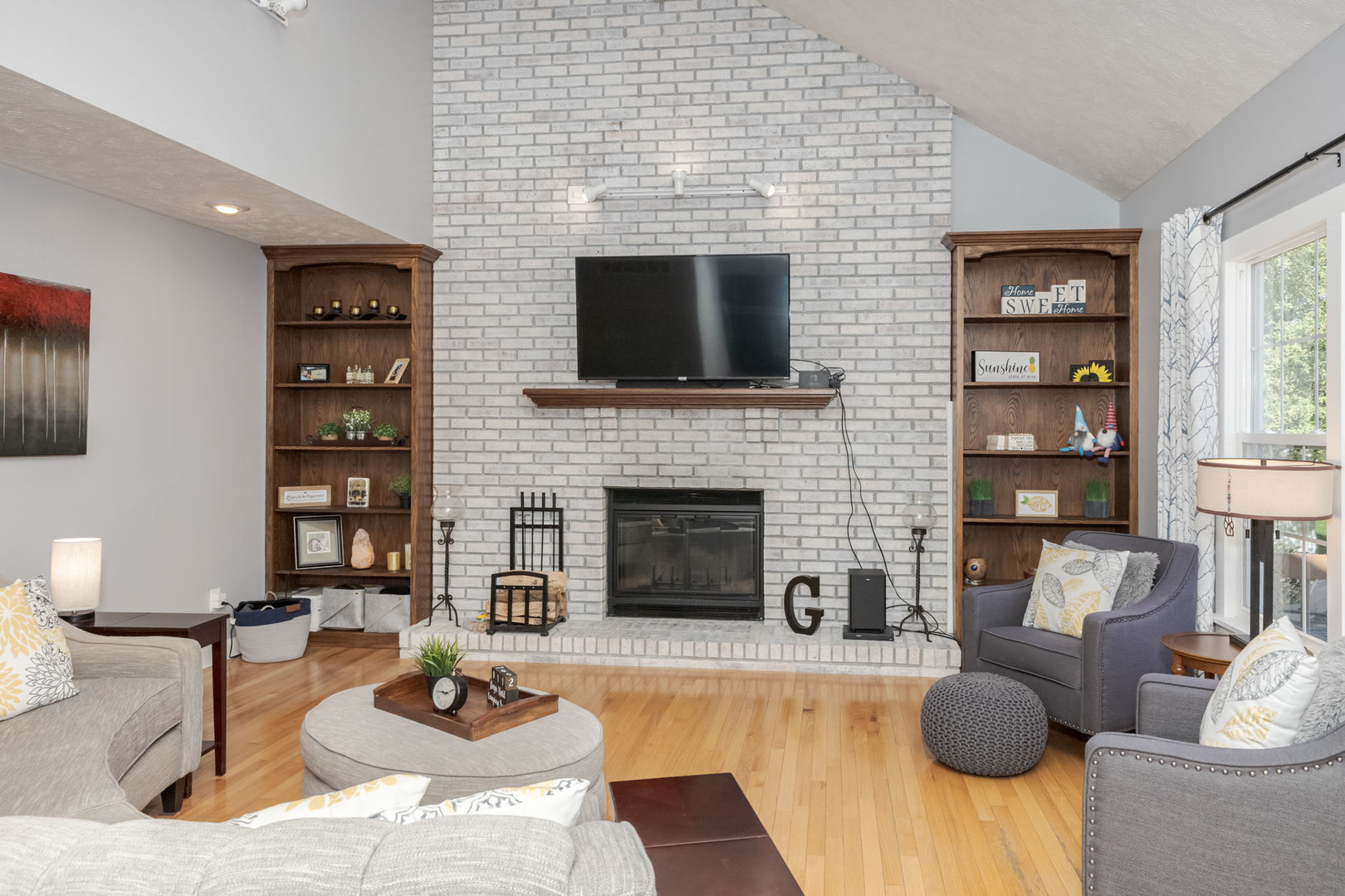 3308 Cumbria Drive Bloomington, IL 61704 - Photo 18 of 48 a living room with furniture and a fireplace