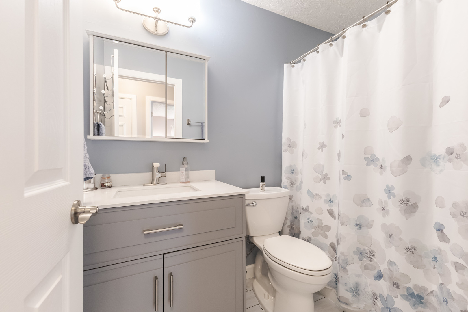 3308 Cumbria Drive Bloomington, IL 61704 - Photo 28 of 48 a bathroom with a granite countertop toilet sink and mirror