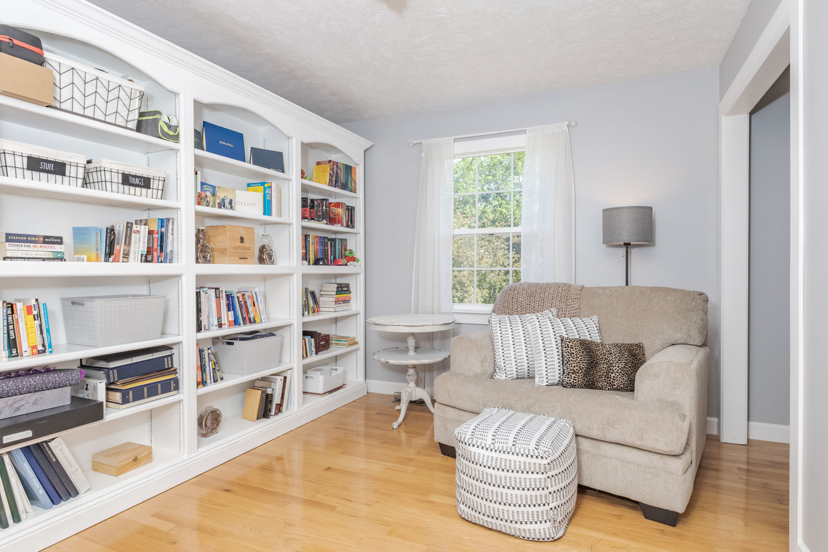 3308 Cumbria Drive Bloomington, IL 61704 - Photo 31 of 48 a living room with furniture and a book shelf