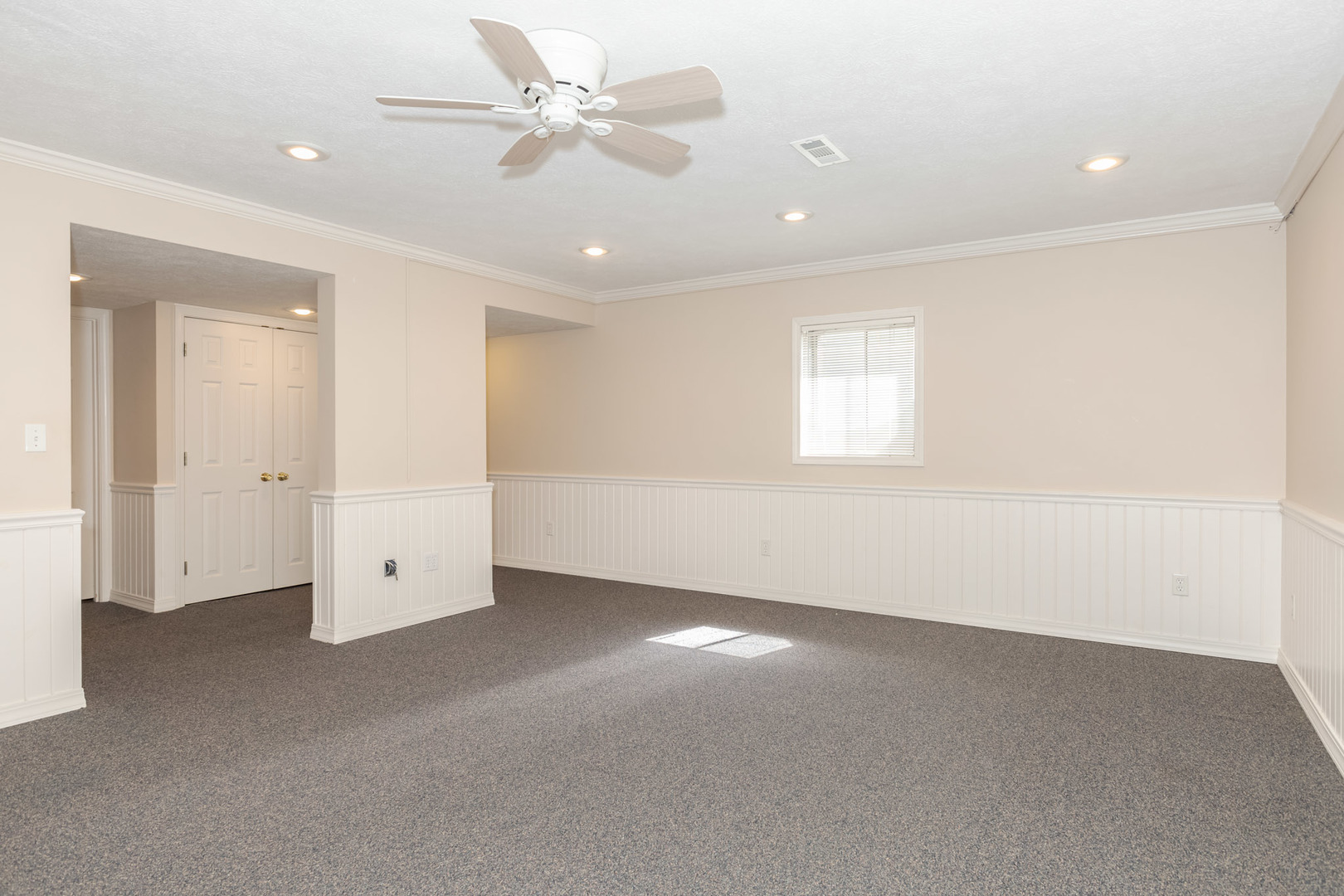 3308 Cumbria Drive Bloomington, IL 61704 - Photo 38 of 48 an empty room with a ceiling fan and a window