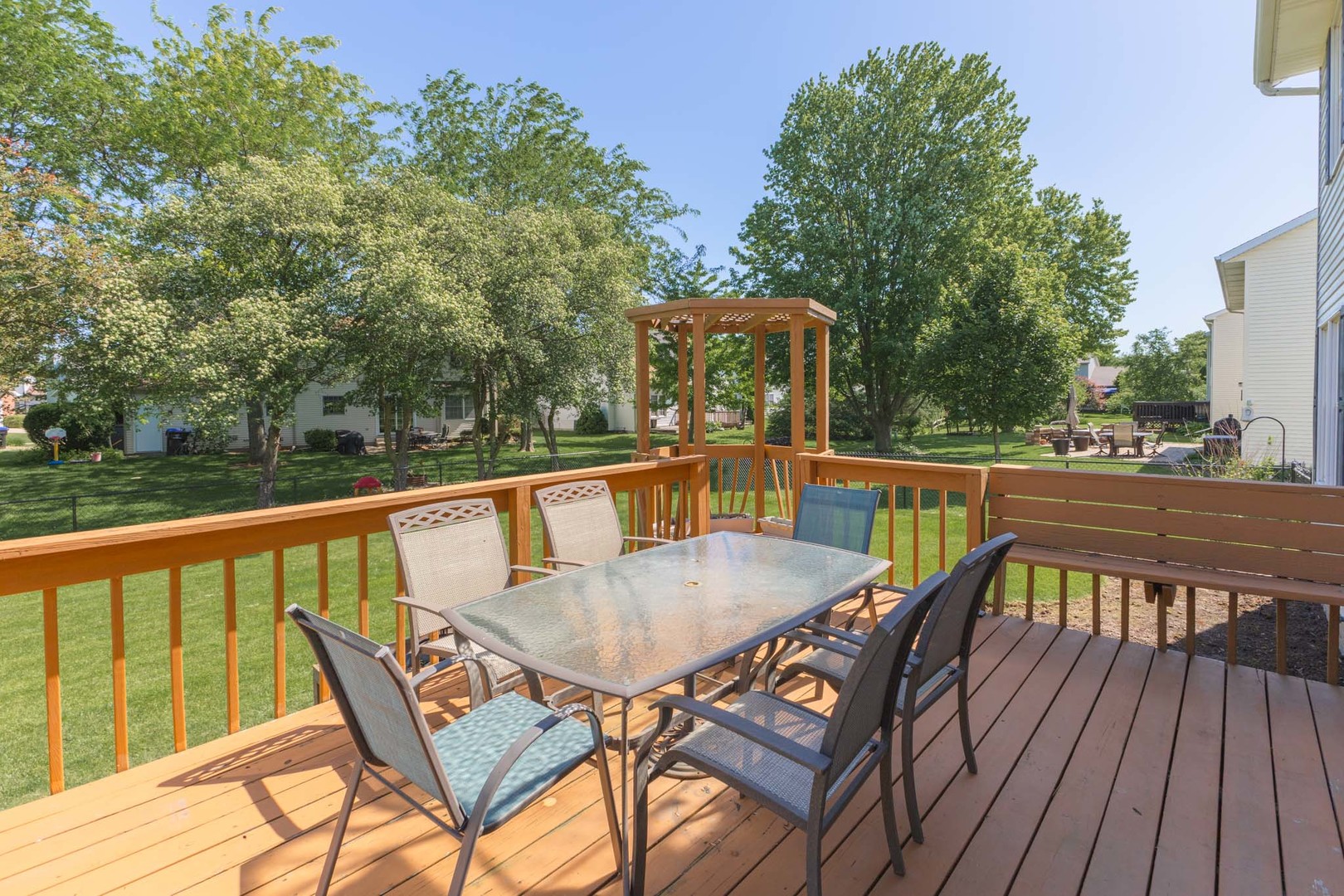 3308 Cumbria Drive Bloomington, IL 61704 - Photo 43 of 48 a balcony with wooden floor table and chairs