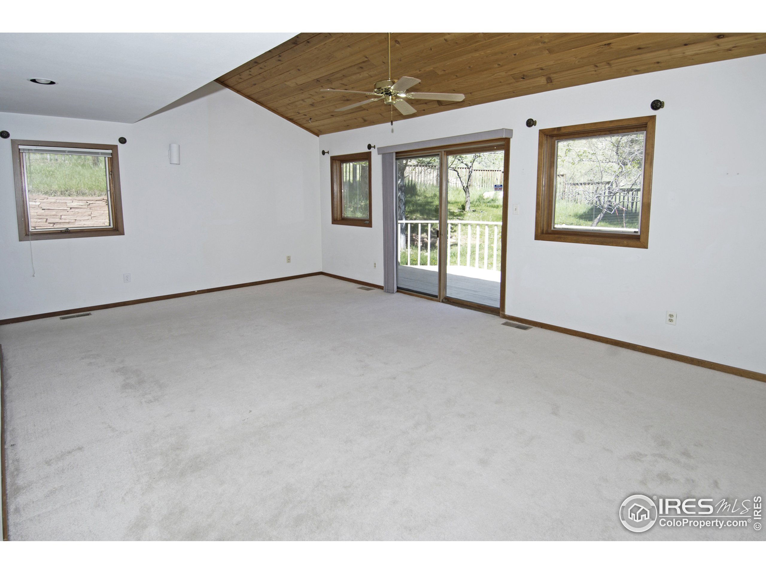 3945 Promontory Court Boulder, CO 80304 - Photo 12 of 18 a view of a big room with windows and chandelier