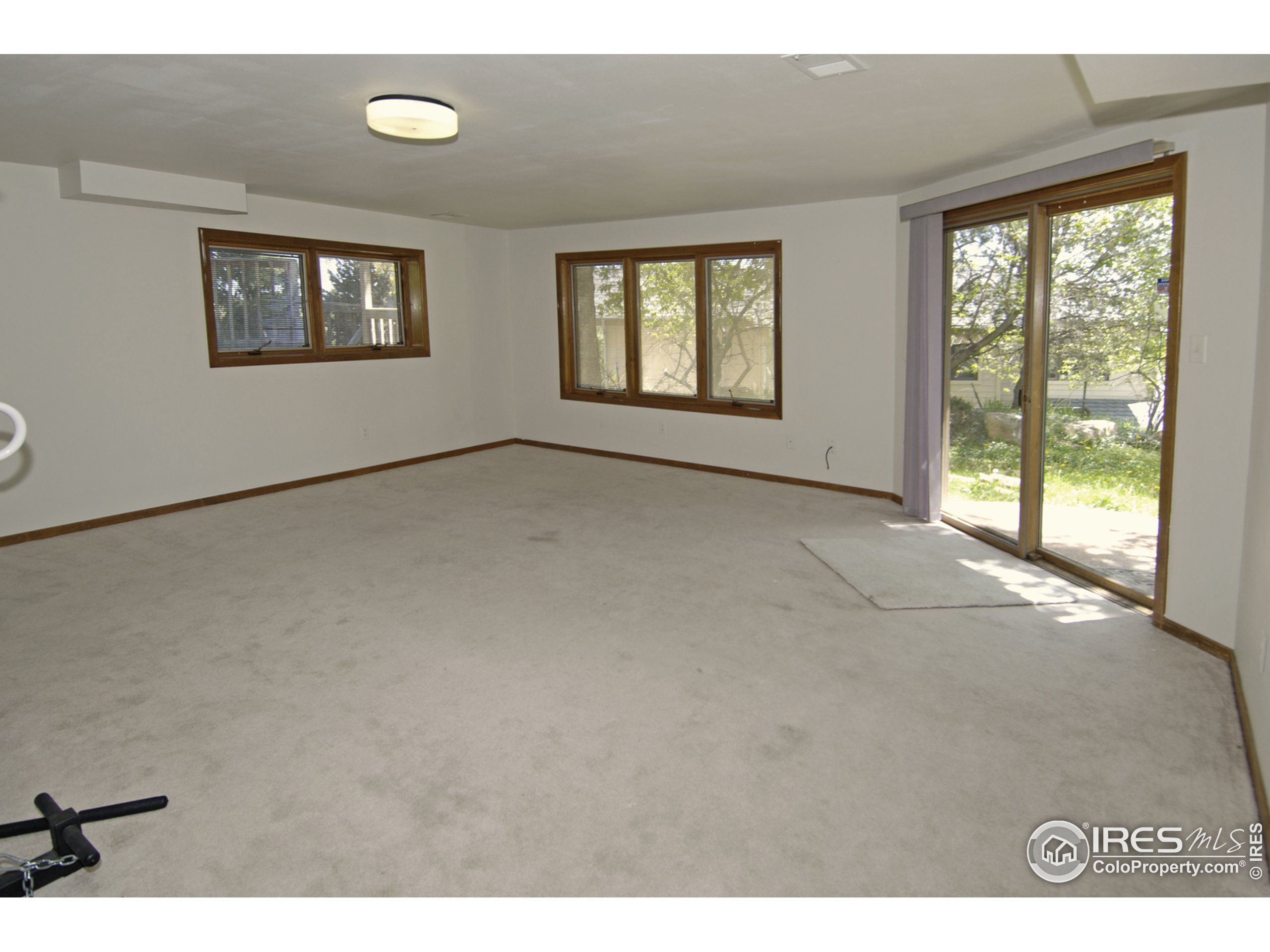 3945 Promontory Court Boulder, CO 80304 - Photo 15 of 18 a view of an empty room with windows