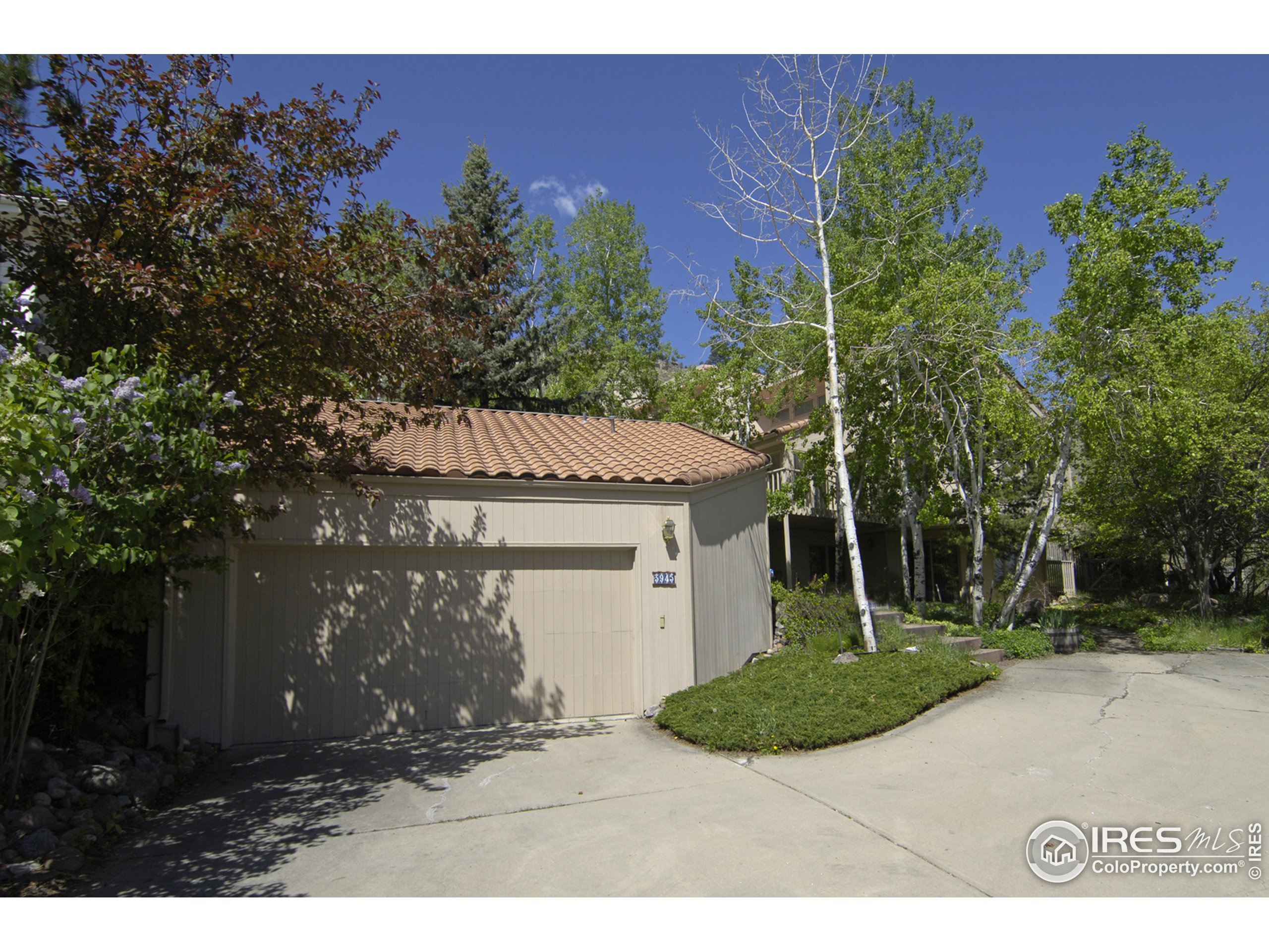 3945 Promontory Court Boulder, CO 80304 - Photo 17 of 18 a view of a house with a yard