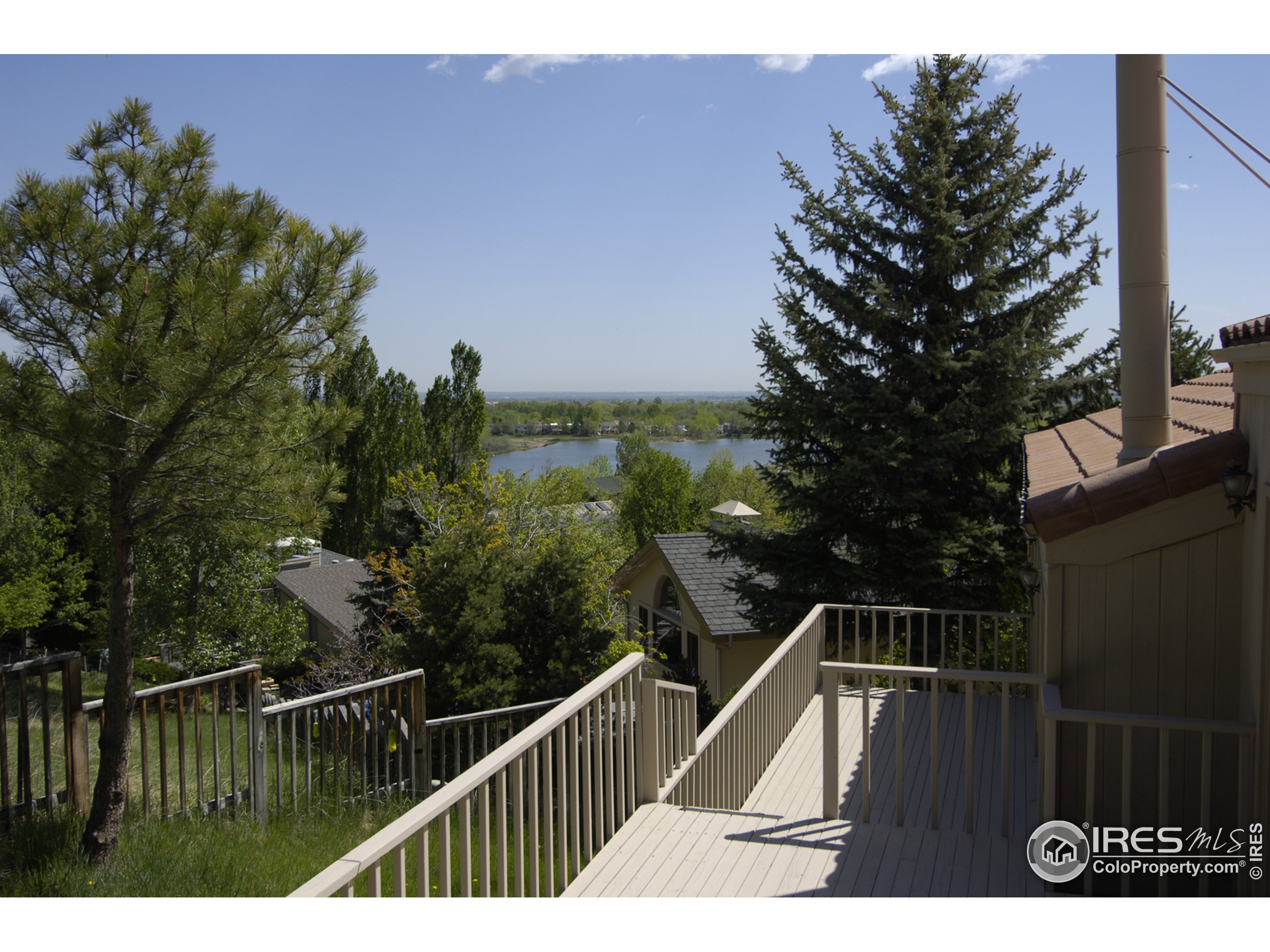 3945 Promontory Court Boulder, CO 80304 - Photo 2 of 18 a view of balcony with wooden floor and fence