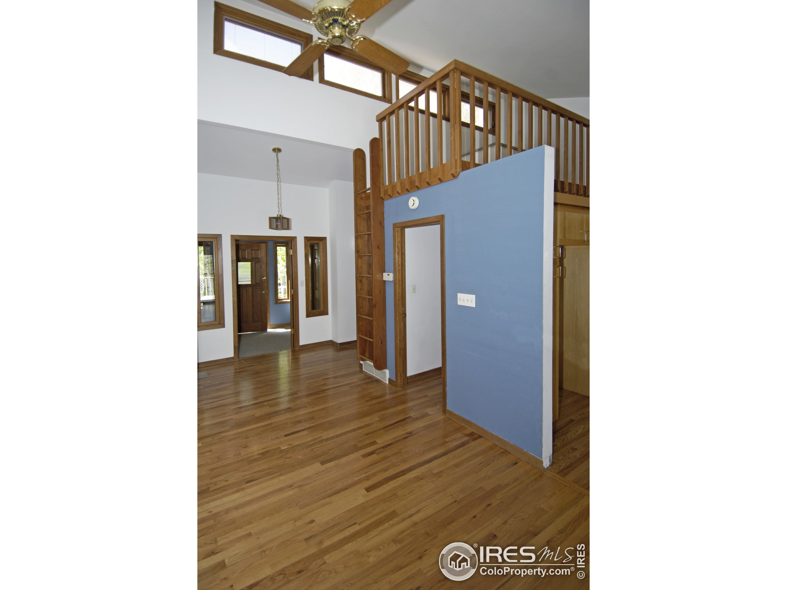 3945 Promontory Court Boulder, CO 80304 - Photo 3 of 18 a view of a hallway with wooden floor
