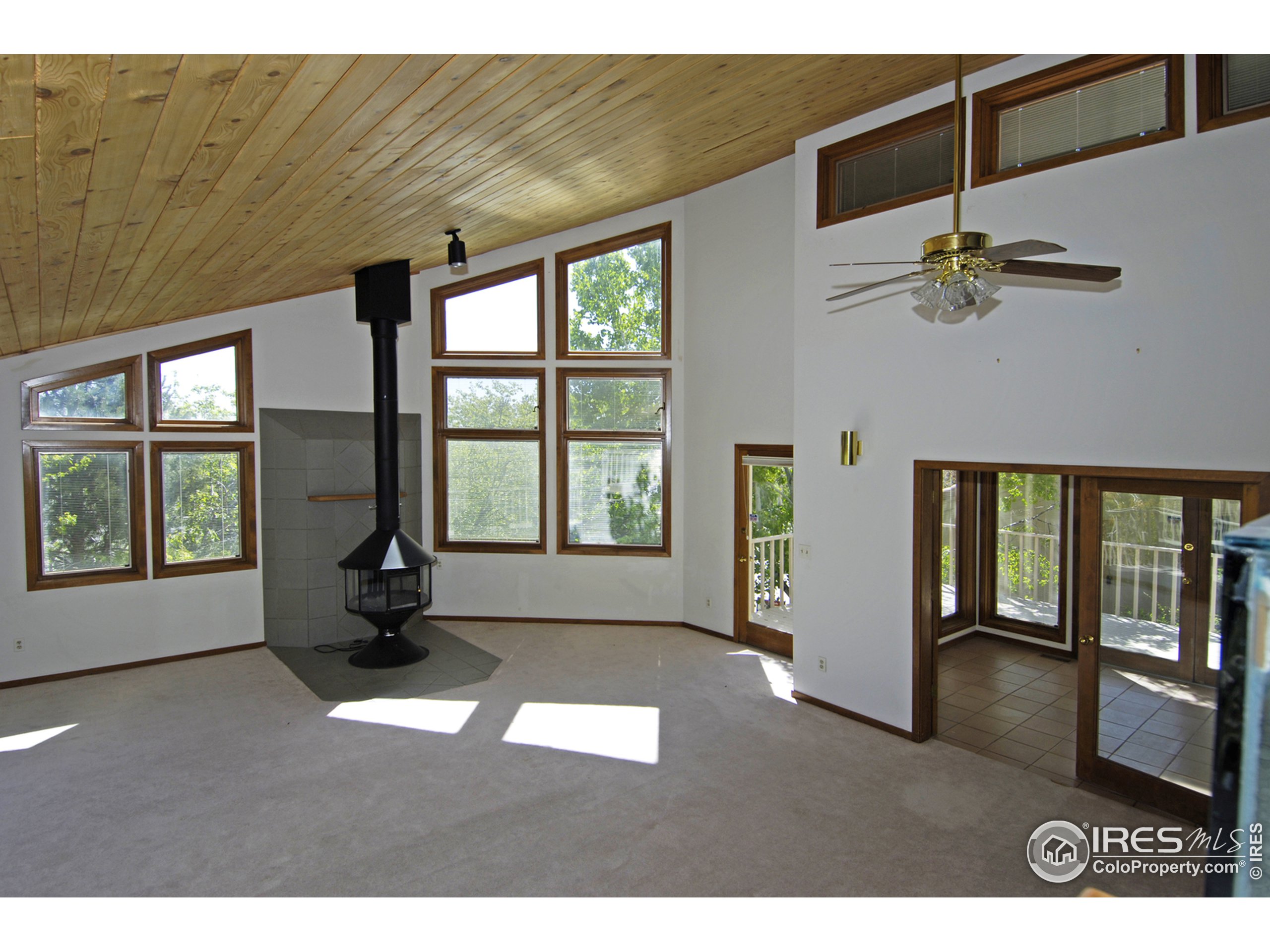 3945 Promontory Court Boulder, CO 80304 - Photo 5 of 18 a living room with furniture and windows