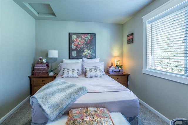 a bedroom with bed and a window