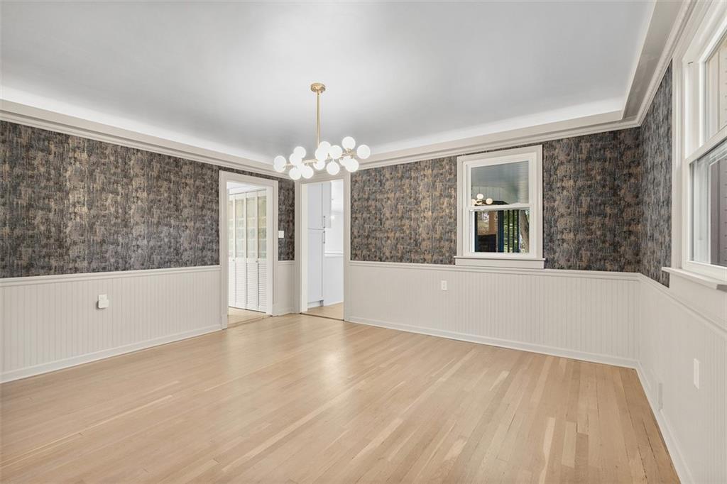 115 Elm Lane Coraopolis, PA 15108 - Photo 13 of 50 a view of an empty room with wooden floor and a window