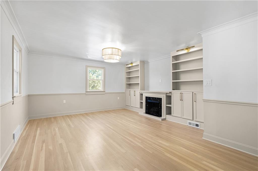 115 Elm Lane Coraopolis, PA 15108 - Photo 16 of 50 wooden floor fireplace and windows in an empty room