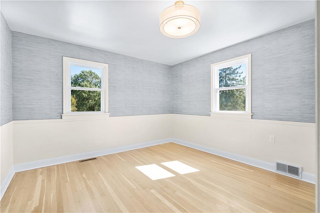 115 Elm Lane Coraopolis, PA 15108 - Photo 19 of 50 a view of an empty room with wooden floor and a window