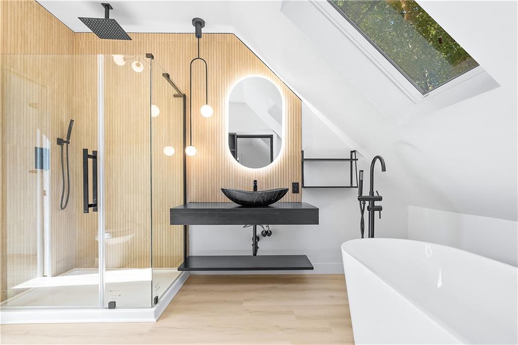 115 Elm Lane Coraopolis, PA 15108 - Photo 29 of 50 a bathroom with a sink a mirror and a bathtub