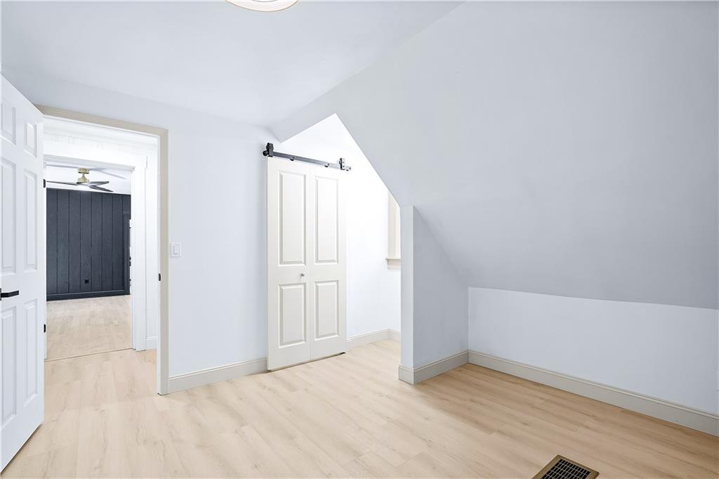 115 Elm Lane Coraopolis, PA 15108 - Photo 36 of 50 an empty room with wooden floor and windows