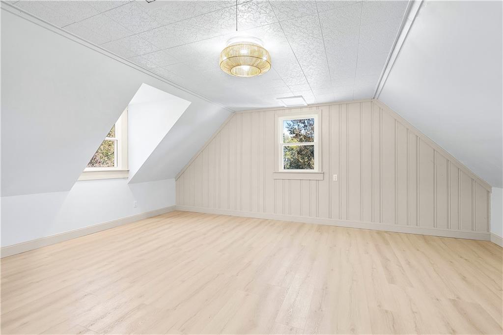 115 Elm Lane Coraopolis, PA 15108 - Photo 41 of 50 an empty room with wooden floor and windows