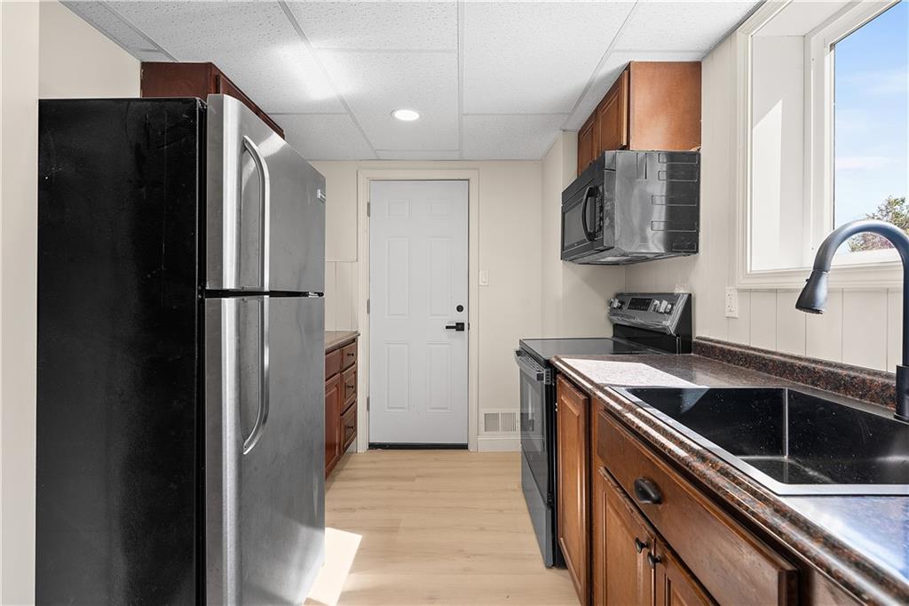 115 Elm Lane Coraopolis, PA 15108 - Photo 47 of 50 a kitchen with stainless steel appliances granite countertop a refrigerator and a sink