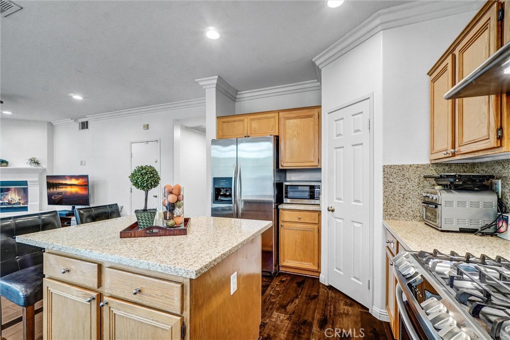 11 Brookhollow Irvine, CA 92602 - Photo 14 of 41 a kitchen with stainless steel appliances granite countertop a sink stove and refrigerator