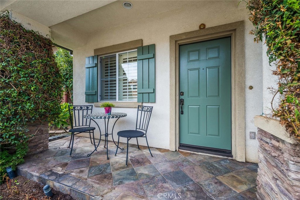 11 Brookhollow Irvine, CA 92602 - Photo 2 of 41 a patio with table and chairs and potted plants