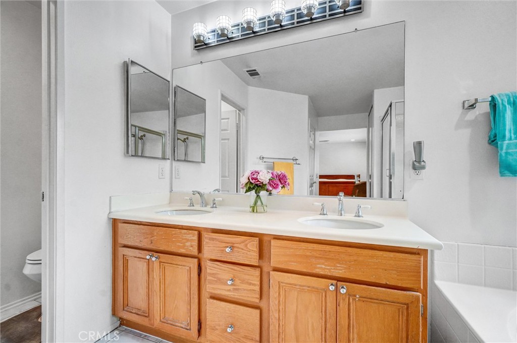 11 Brookhollow Irvine, CA 92602 - Photo 23 of 41 a bathroom with a sink and a mirror