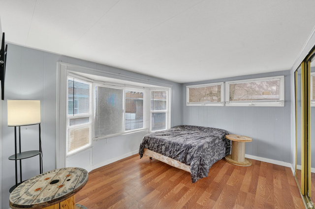 24 Grover Street Layton, UT 84041 - Photo 19 of 21 Bedroom featuring wood finished floors and baseboards