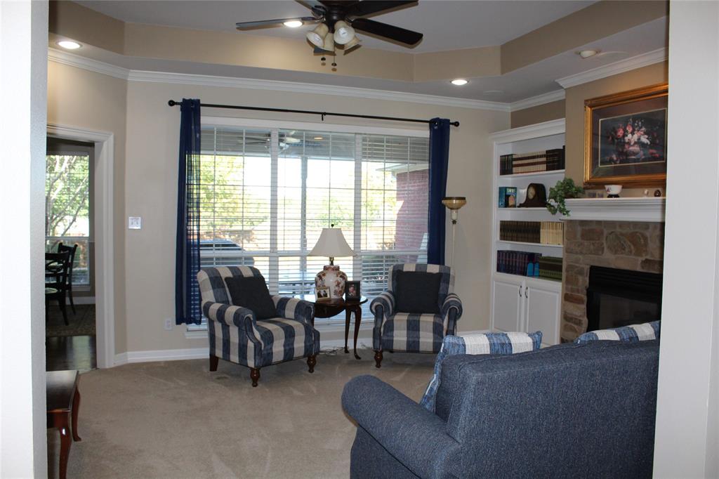 2131 Deer Run Denison, TX 75020 - Photo 16 of 35 a living room with fireplace furniture and a large window