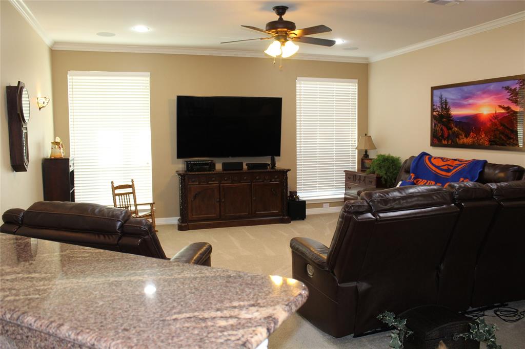 2131 Deer Run Denison, TX 75020 - Photo 19 of 35 a living room with furniture and a flat screen tv