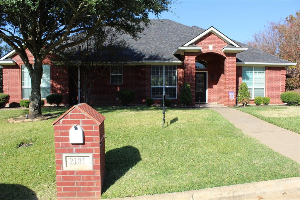2131 Deer Run Denison, TX 75020 - Photo 2 of 35 a front view of a house with a yard