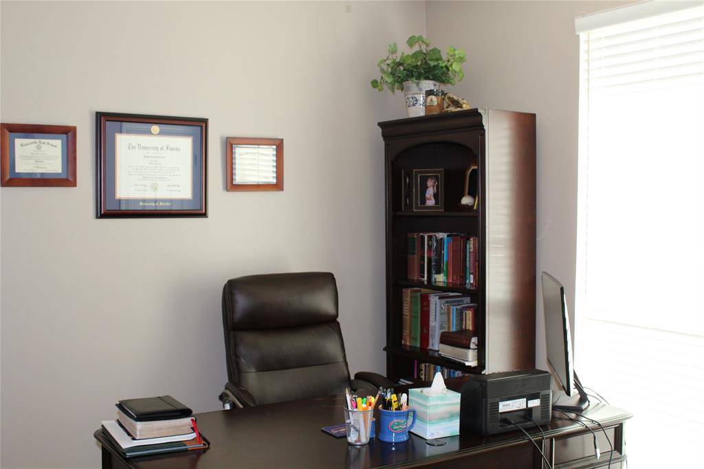 2131 Deer Run Denison, TX 75020 - Photo 21 of 35 a room with furniture and wooden floor