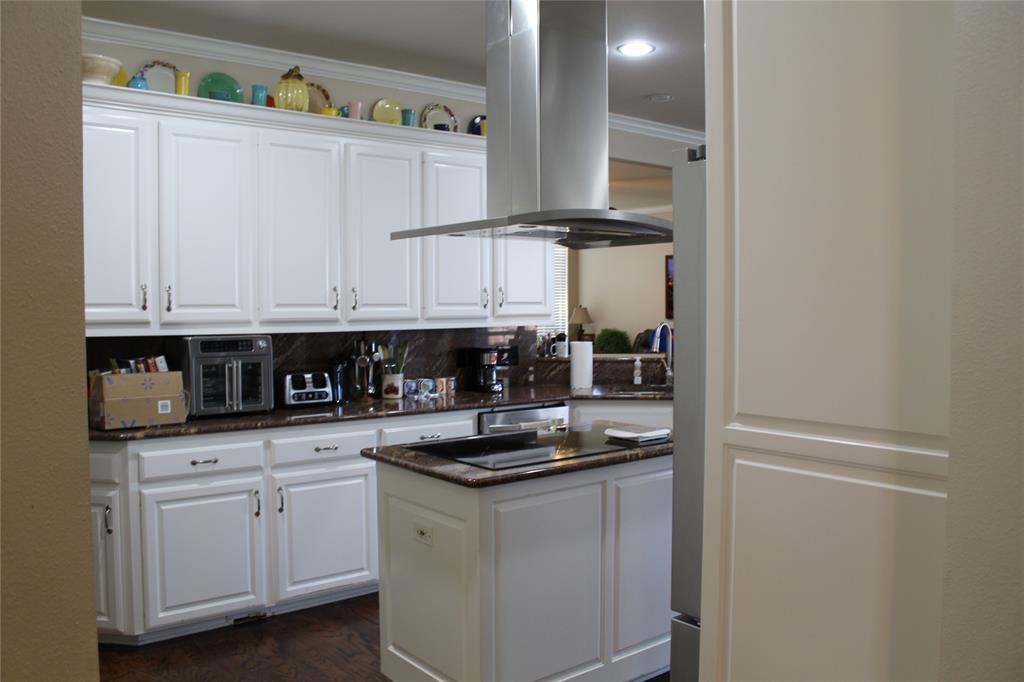 2131 Deer Run Denison, TX 75020 - Photo 22 of 35 a kitchen with white cabinets and appliances