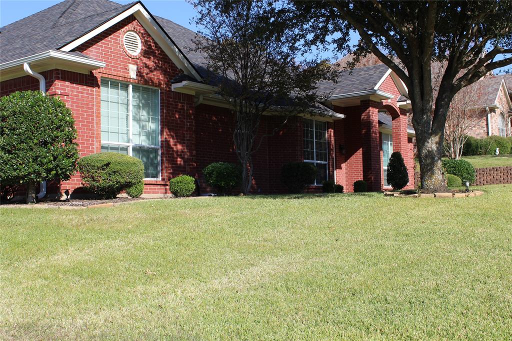 2131 Deer Run Denison, TX 75020 - Photo 3 of 35 a view of a house with a yard and plants