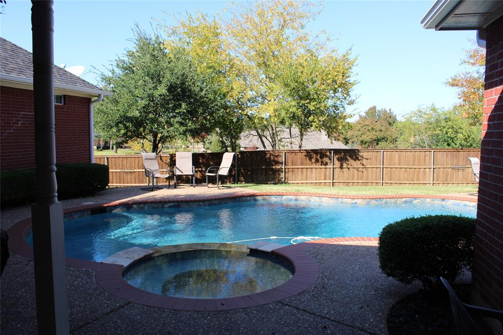 2131 Deer Run Denison, TX 75020 - Photo 5 of 35 a view of swimming pool with seating space and trees in the background