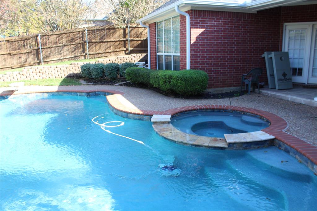 2131 Deer Run Denison, TX 75020 - Photo 9 of 35 a view of a backyard with plants and barbeque grill