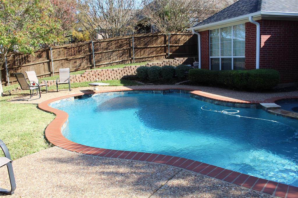 2131 Deer Run Denison, TX 75020 - Photo 10 of 35 a view of a swimming pool with some potted plants