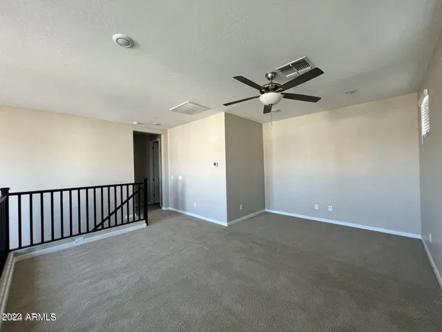 a white toilet sitting next to a bath tub