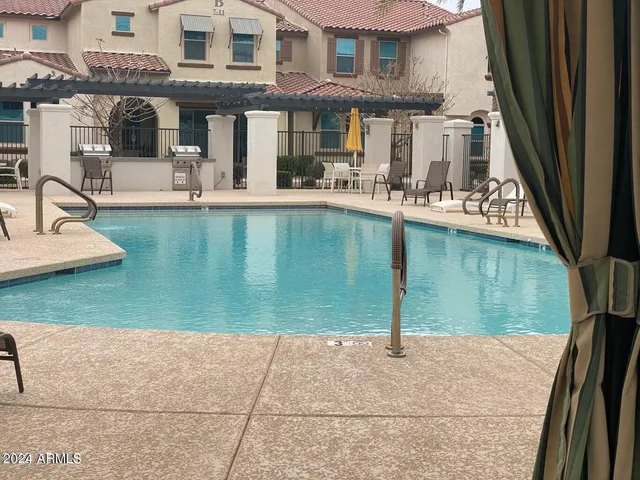 an aerial view of a house with garden space and lake view