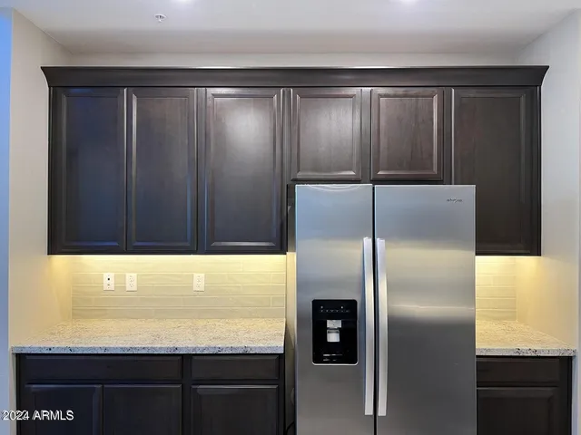 a view of kitchen with a sink and wooden floor