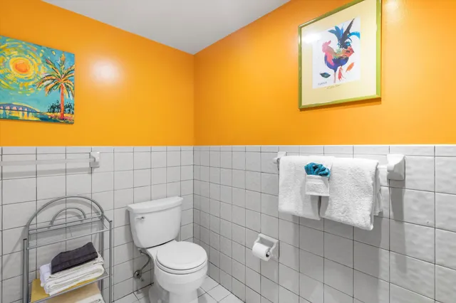 a bathroom with a sink a toilet and a shower