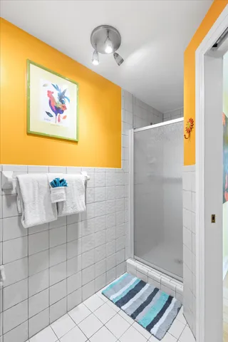 a view of a hallway with wooden floor and windows