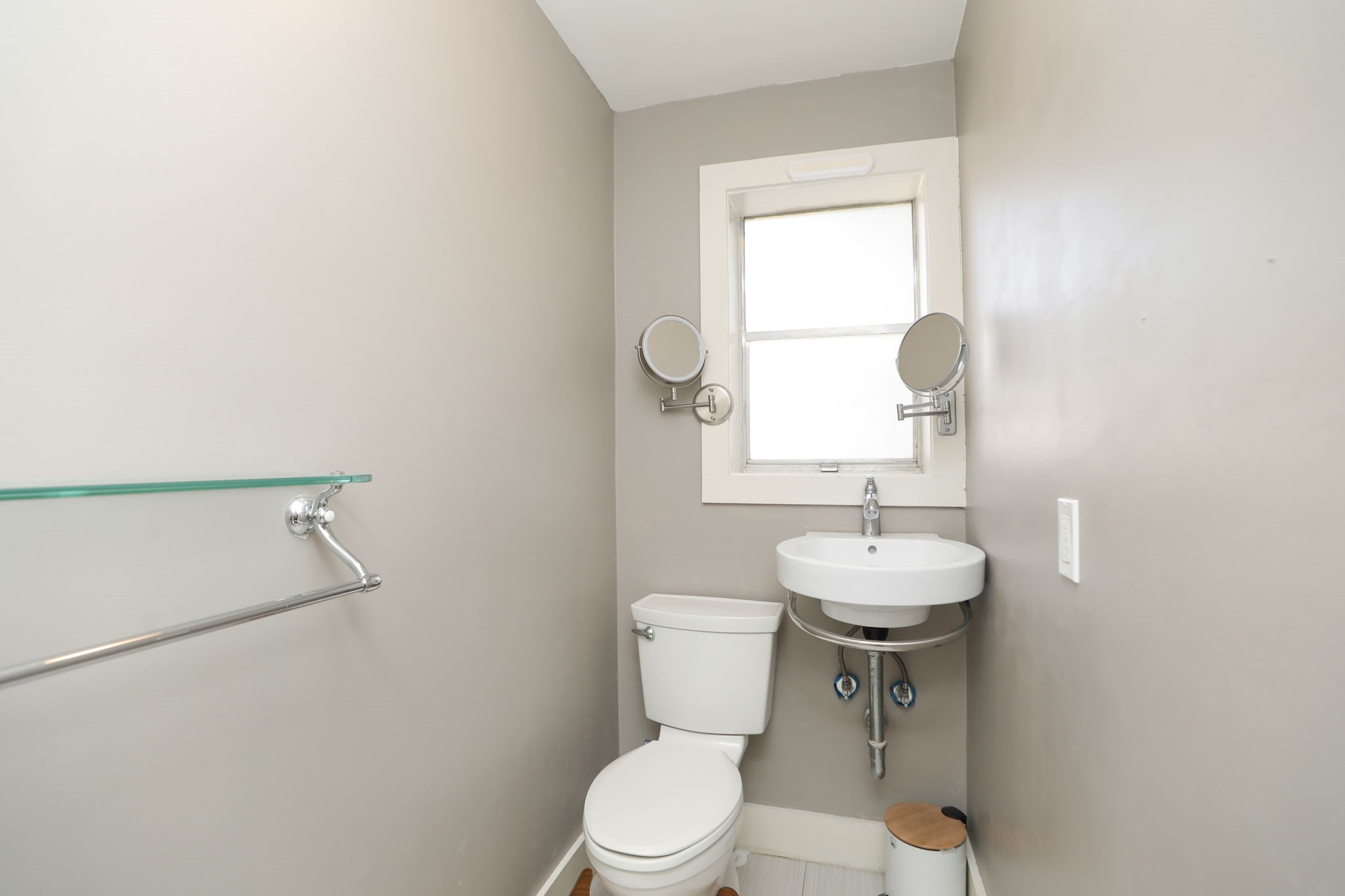 2215 Cleburne Street Houston, TX 77004 - Photo 19 of 21 a bathroom with a toilet a sink and a window
