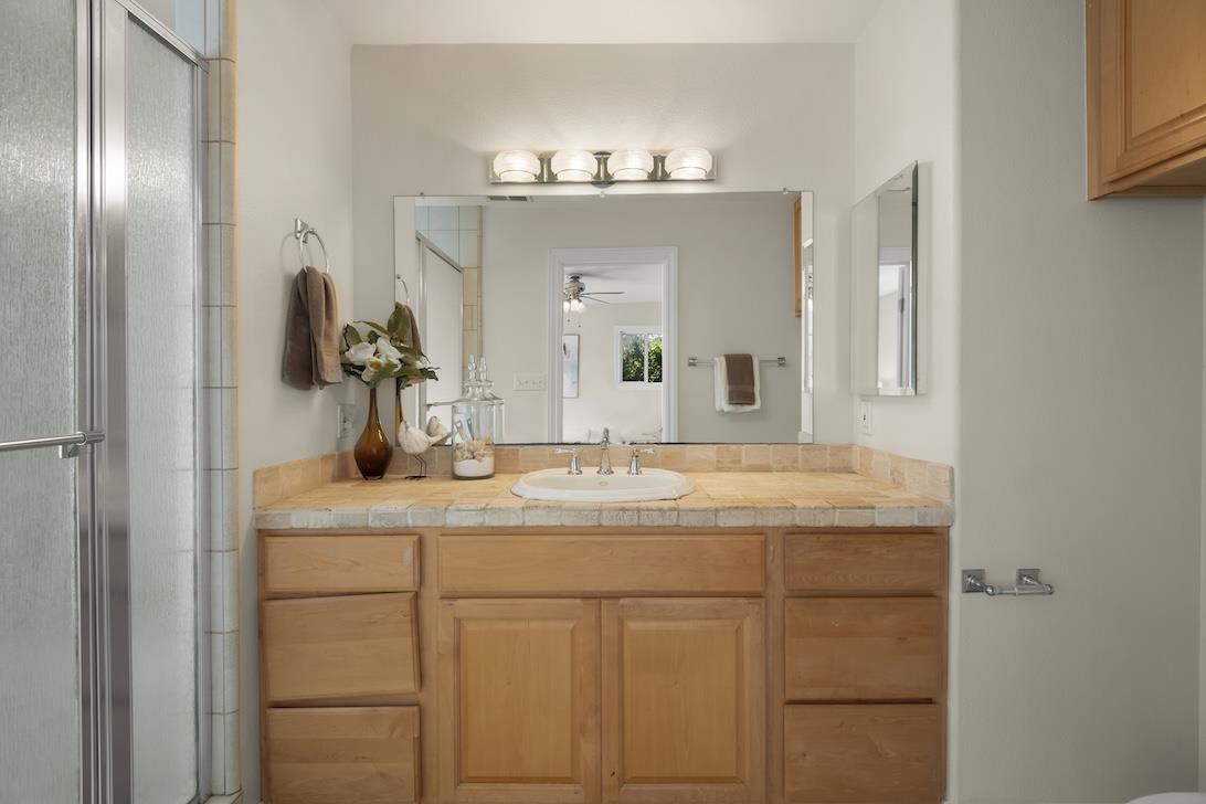 2510 Villanova Road San Jose, CA 95130 - Photo 10 of 21 a bathroom with a granite countertop sink a mirror and a shower