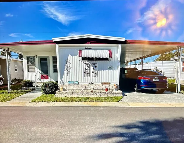 a view of a car park in front of house