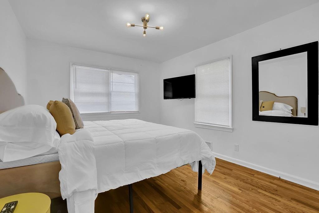 1124 Longshore Drive Decatur, GA 30032 - Photo 11 of 18 a bedroom with a bed and a flat screen tv